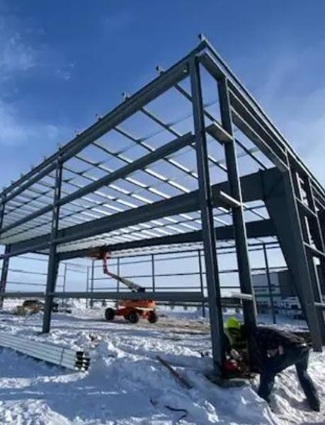 AWK Corporation steel column installation for industrial warehouse framework